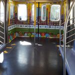 Seats were taken out at the end of the subway cars for more standing room. <br>